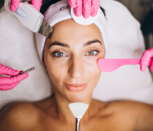 Licensed cosmetologist performing skin care work.